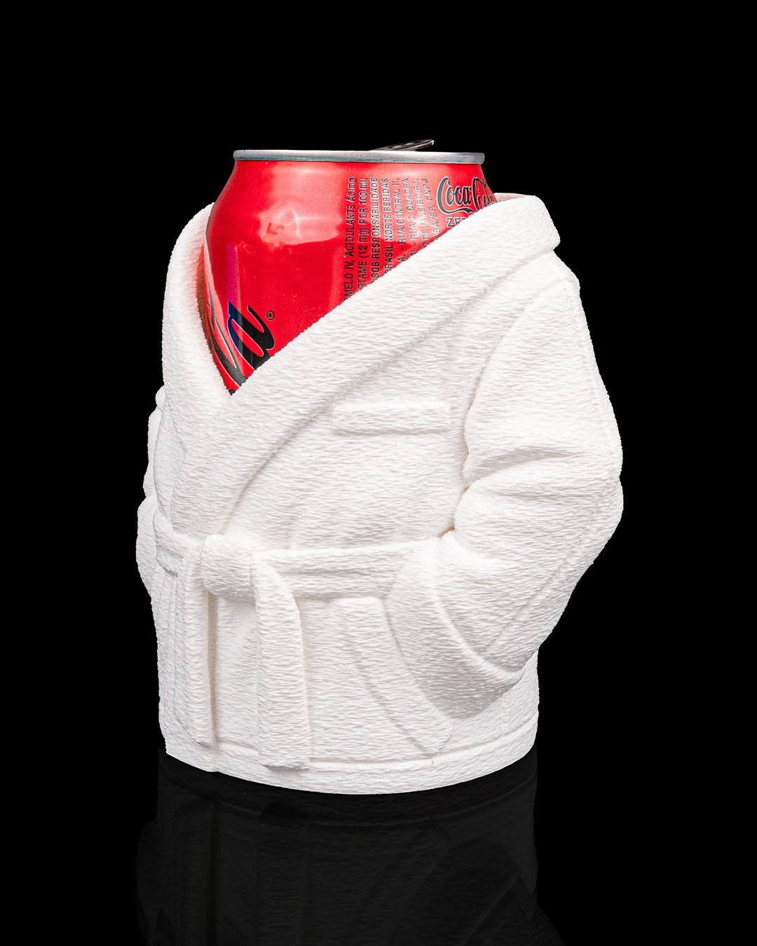 White robe-style can cooler with a red Coca-Cola can on a black background