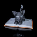 Whimsical cat book holder for readers