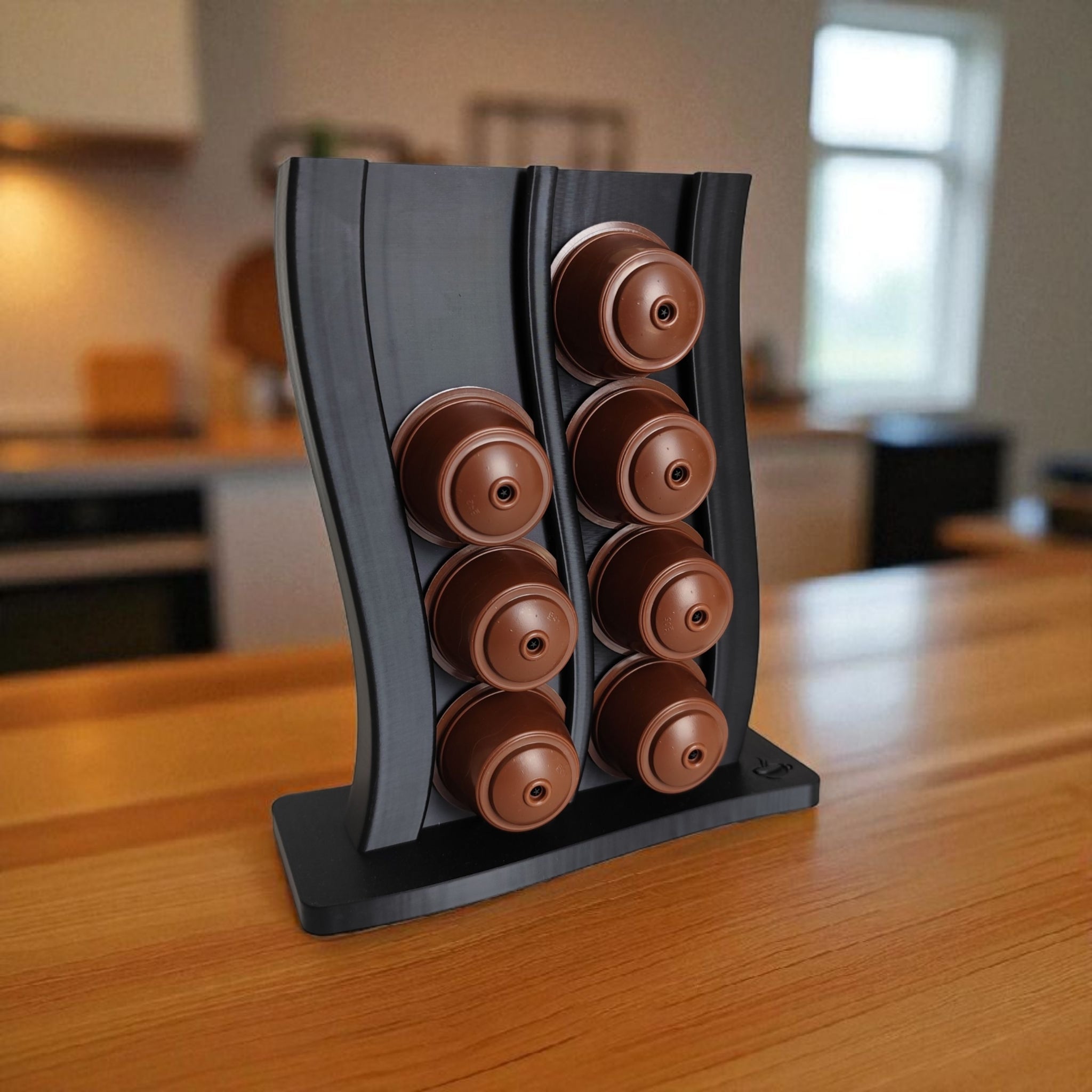 Wavy Dolce Gusto capsule holder on a kitchen counter with coffee machine.