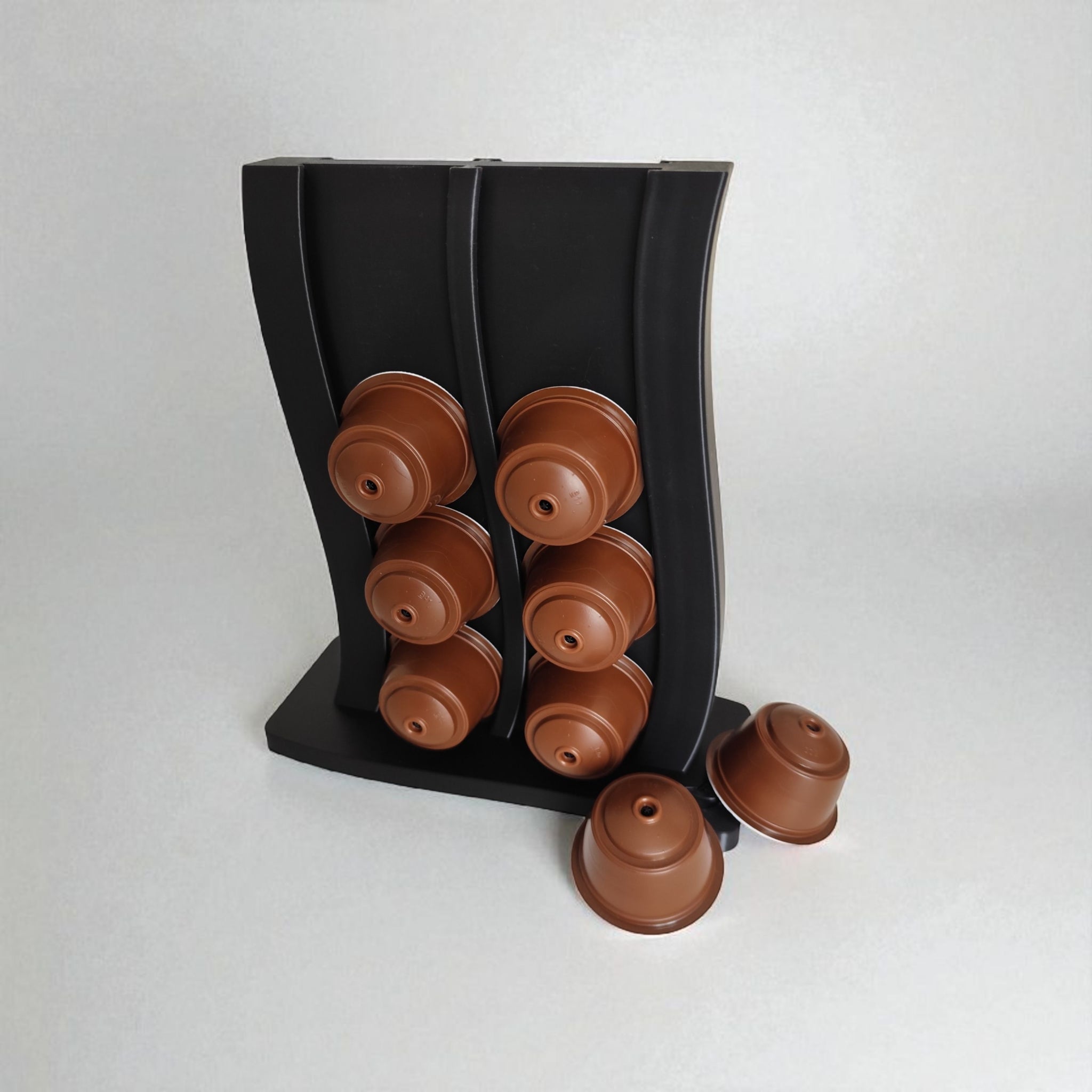 Side view of the stand filled with colourful Dolce Gusto coffee pods.