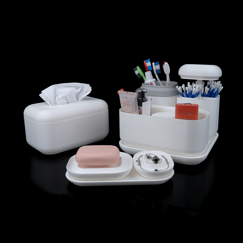 White bathroom organizer with various items including a tissue box, soap, and toothbrush holder on a black background.