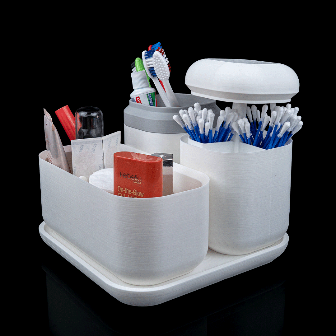 White bathroom caddy with toothbrushes, toothpaste, and other toiletries on a black background