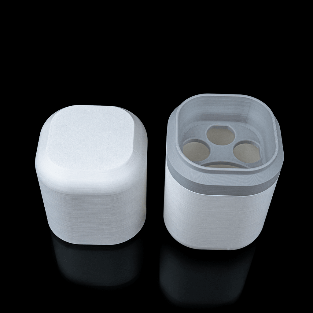 White plastic container with lid on a black background