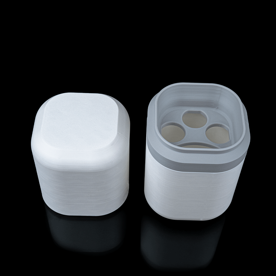 White plastic container with lid on a black background