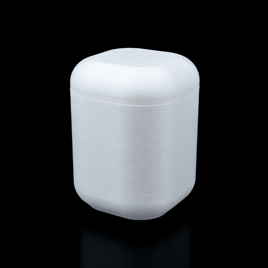 White cylindrical container with lid on a black background