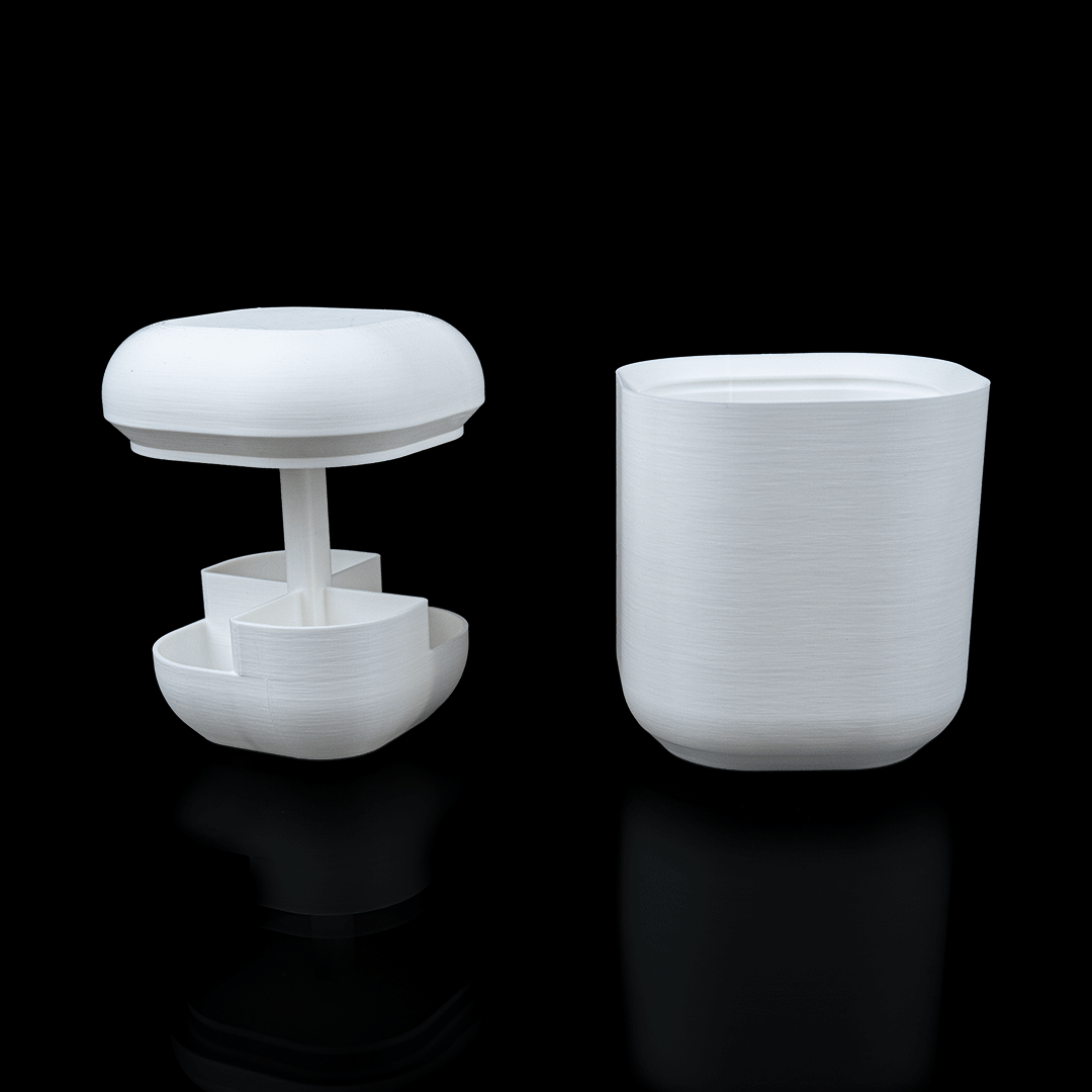 White cylindrical container with a lid on a black background