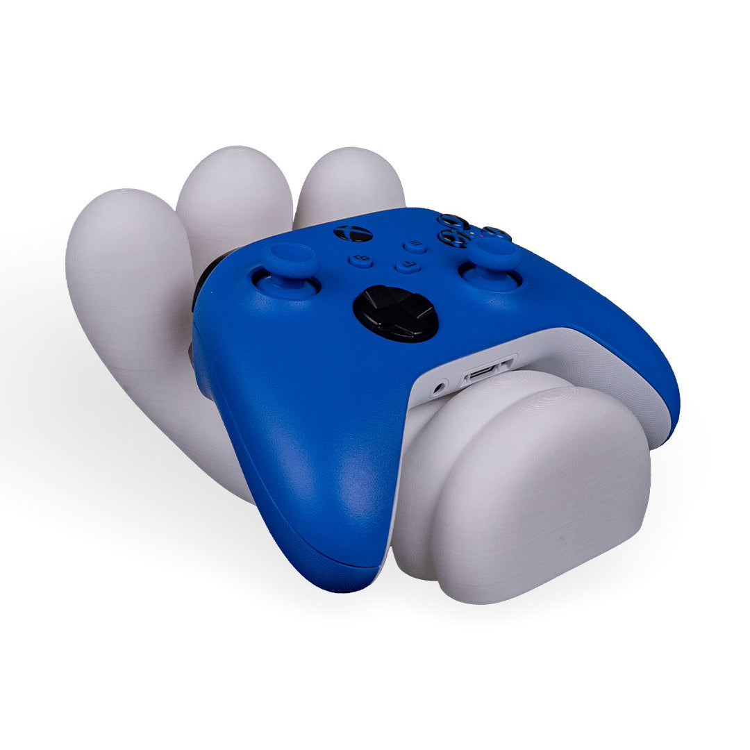 Grabby McGlove 3D printed controller holder securely holding a gaming controller on a desk