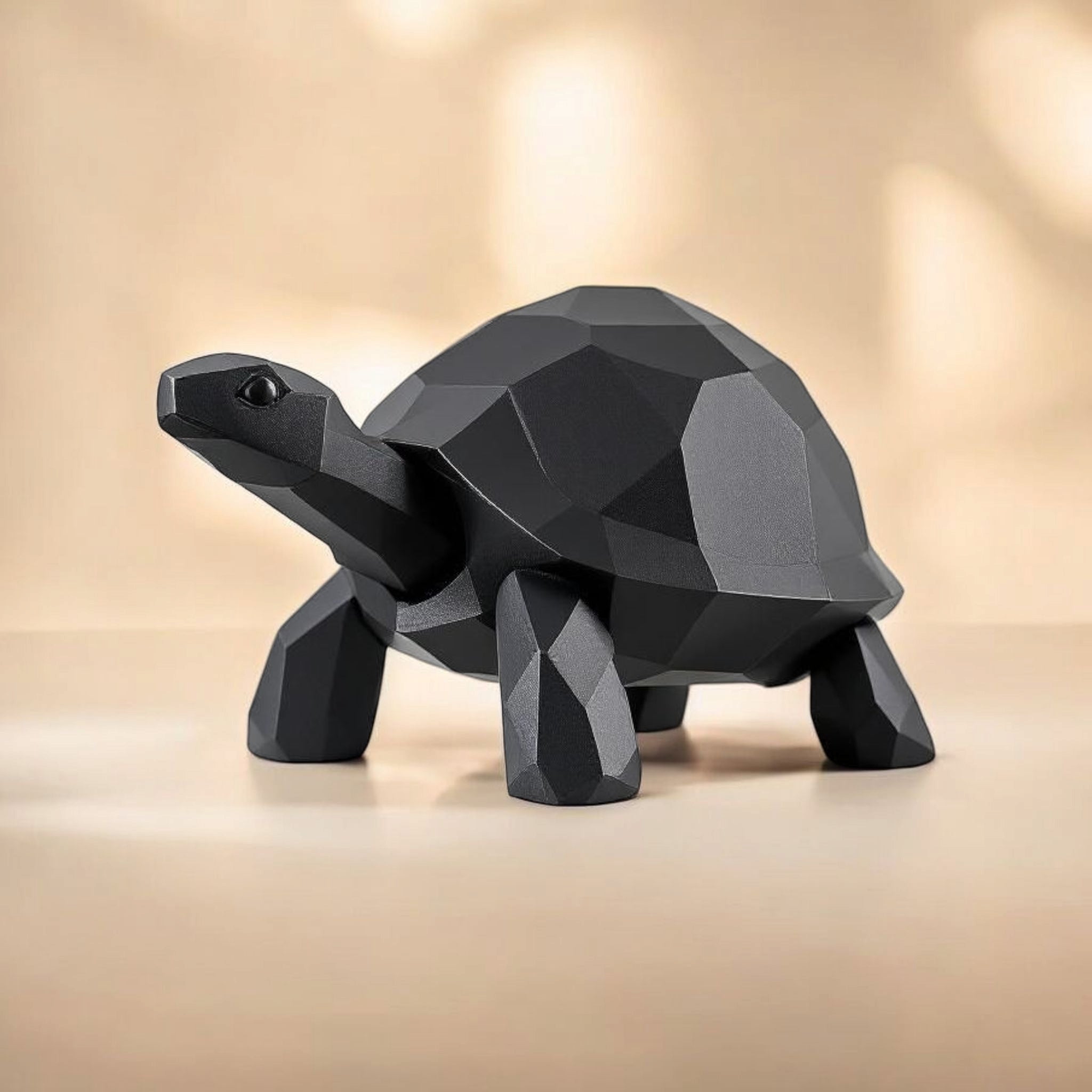 Black geometric turtle sculpture on a beige background
