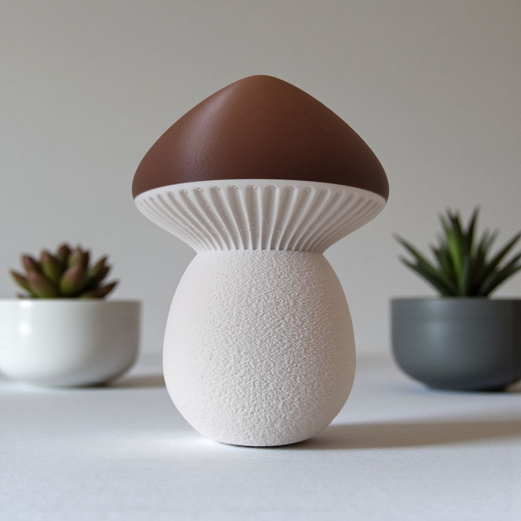 Mushroom-shaped decorative item with brown cap and white body on a neutral background