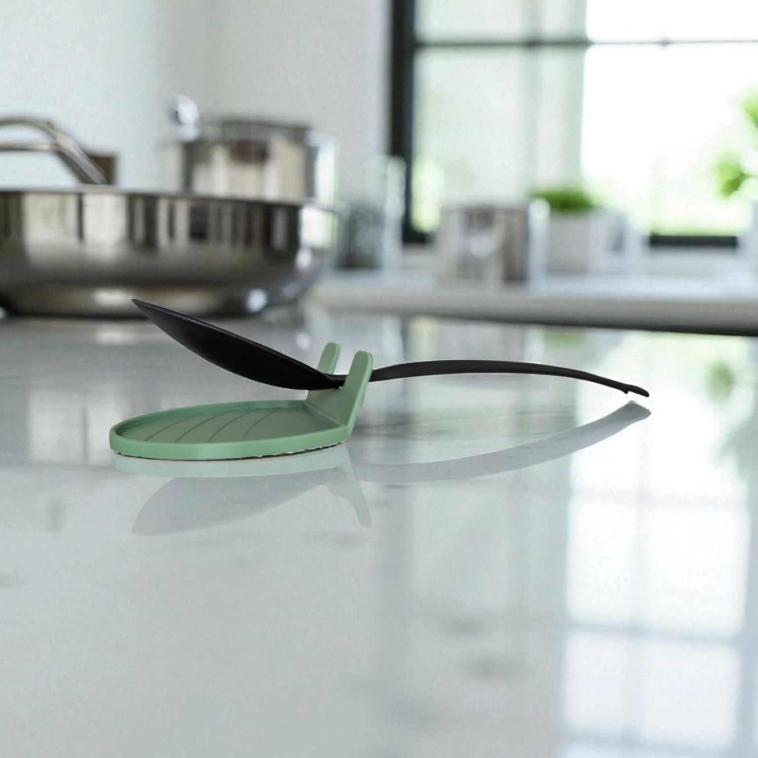 Shot of the CookSitter spoon rest in use during cooking, with a clean kitchen counter.