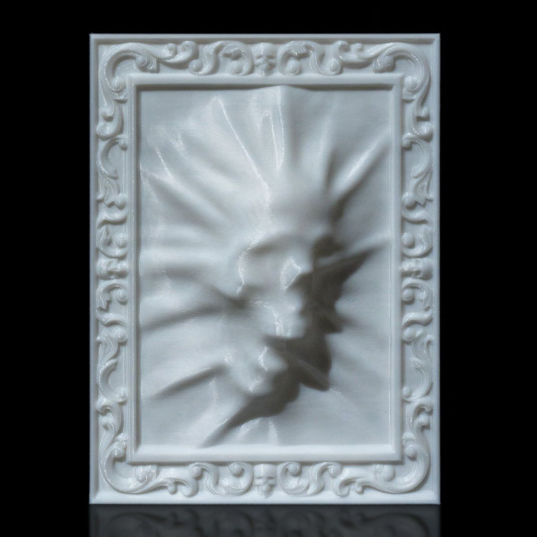 Decorative white wall art with intricate patterns on a black background