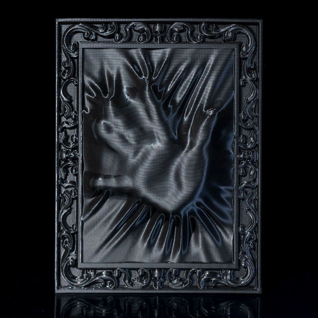 Decorative black frame with a textured design on a black background