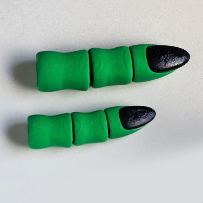 Two green and black finger-shaped objects on a white background