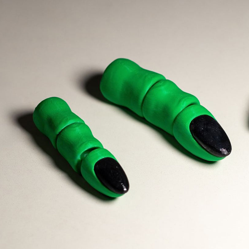A close-up of the 3D Printed Witch Finger's black nail and detailed finger wrinkles