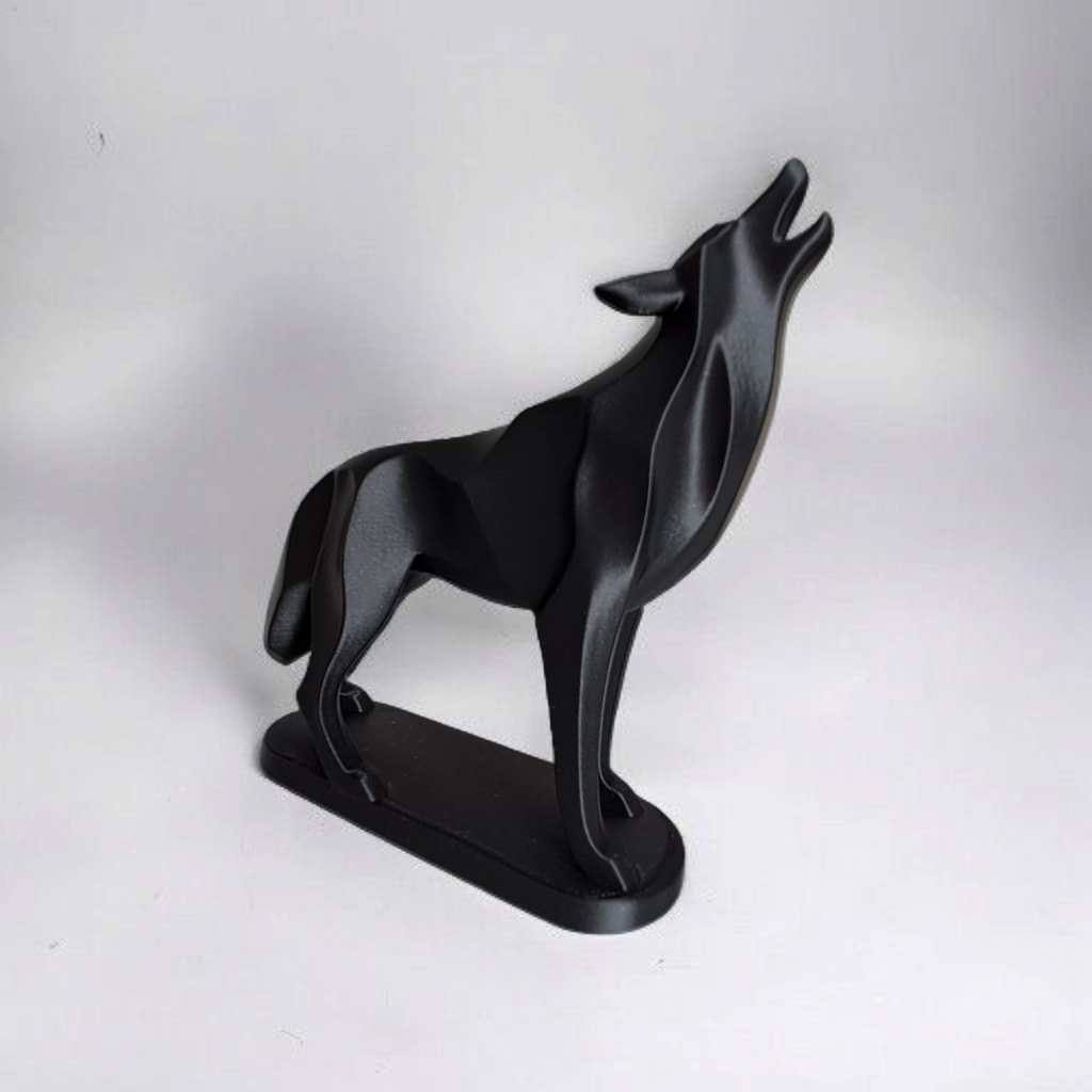 Black wolf-shaped object on a white background