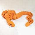 Orange snake-shaped toy on a white background