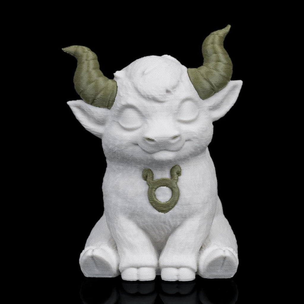 Taurus chibi bull figure on its own, with green horns and the Taurus symbol on its chest