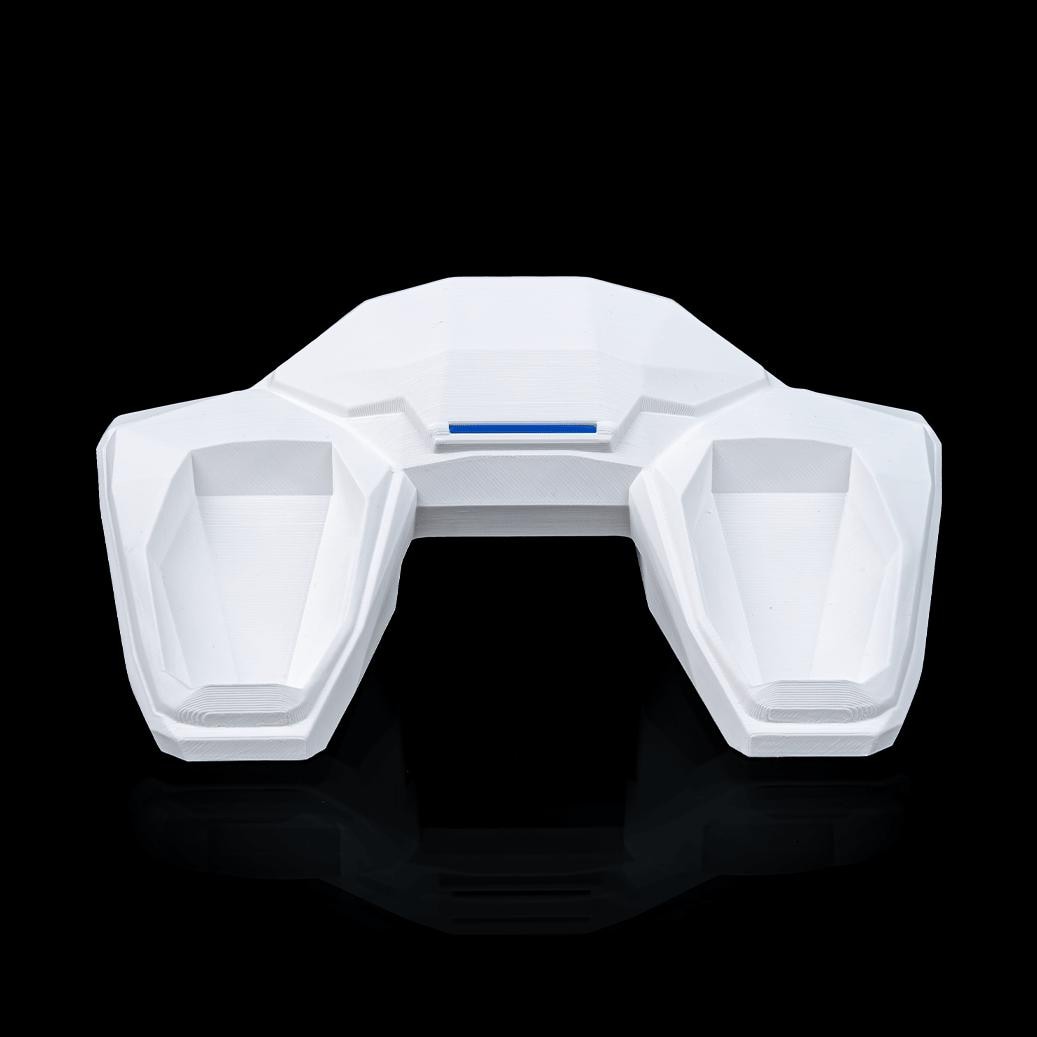All-white geometric controller stand from above