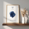 Aries zodiac constellation print in indigo watercolour, with the Aries symbol and dates, in a wood frame on a shelf