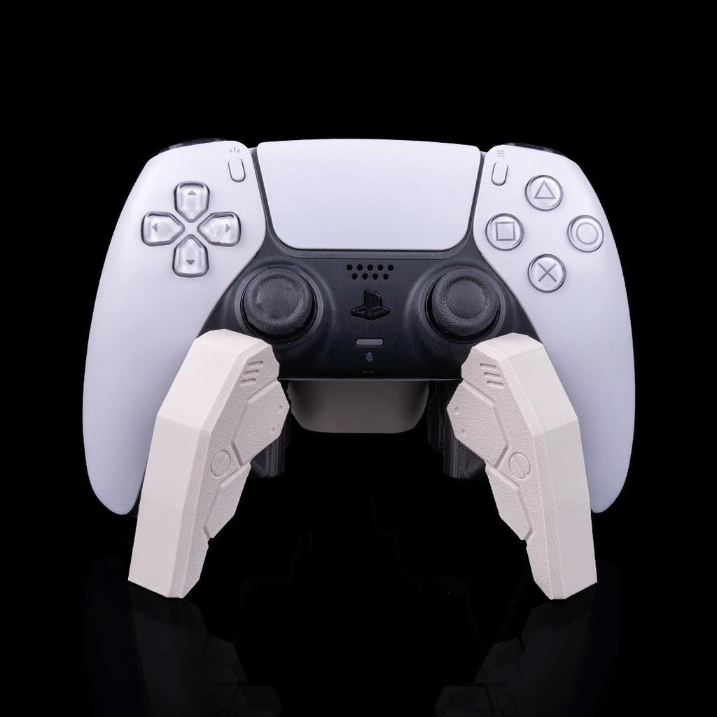 Robot spider stand holding a white PS5 controller from the front