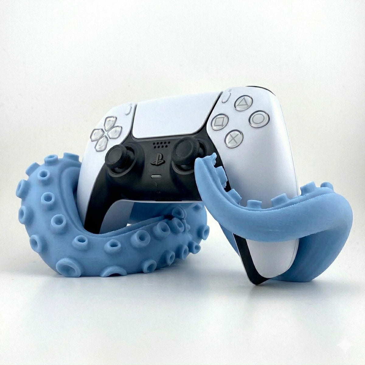 Light blue kraken tentacle stand with a PS5 controller