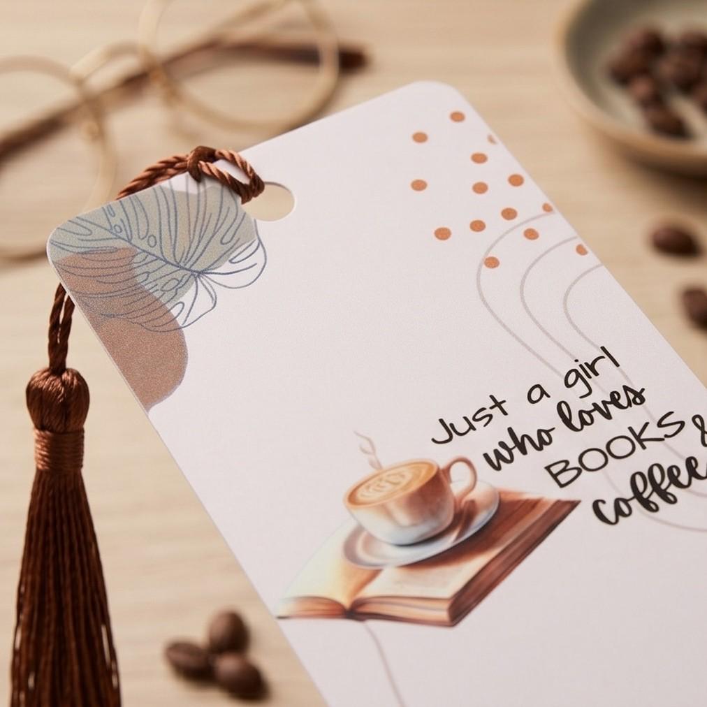 Close-up of the latte, open book and lettering on the bookmark