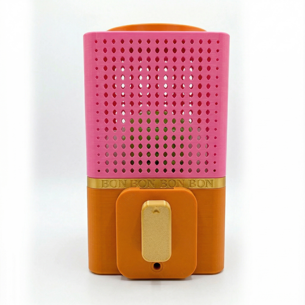 Pink and orange BONBON Vending Machine with a gold band on a white background
