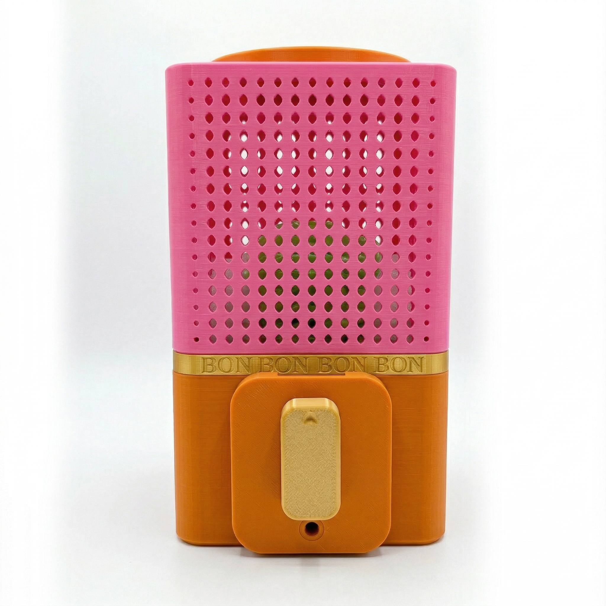 Pink and orange BONBON Vending Machine with a gold band on a white background