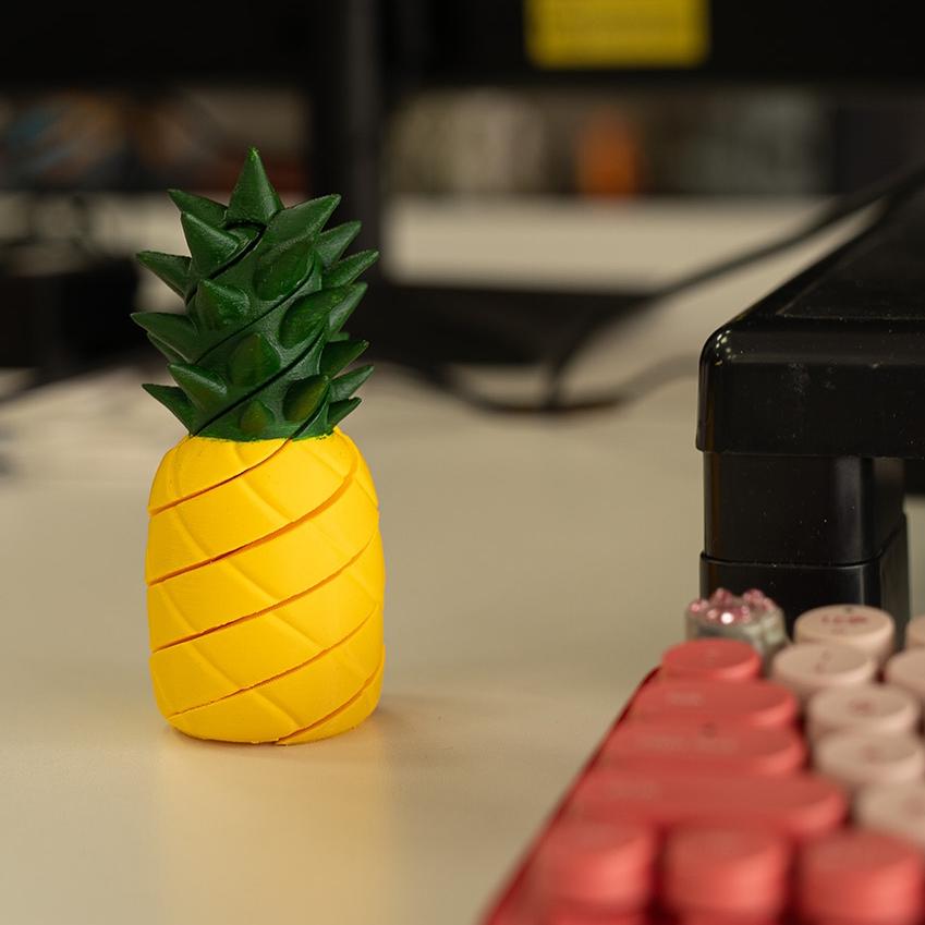Pineapple-shaped object on a surface with a blurred background