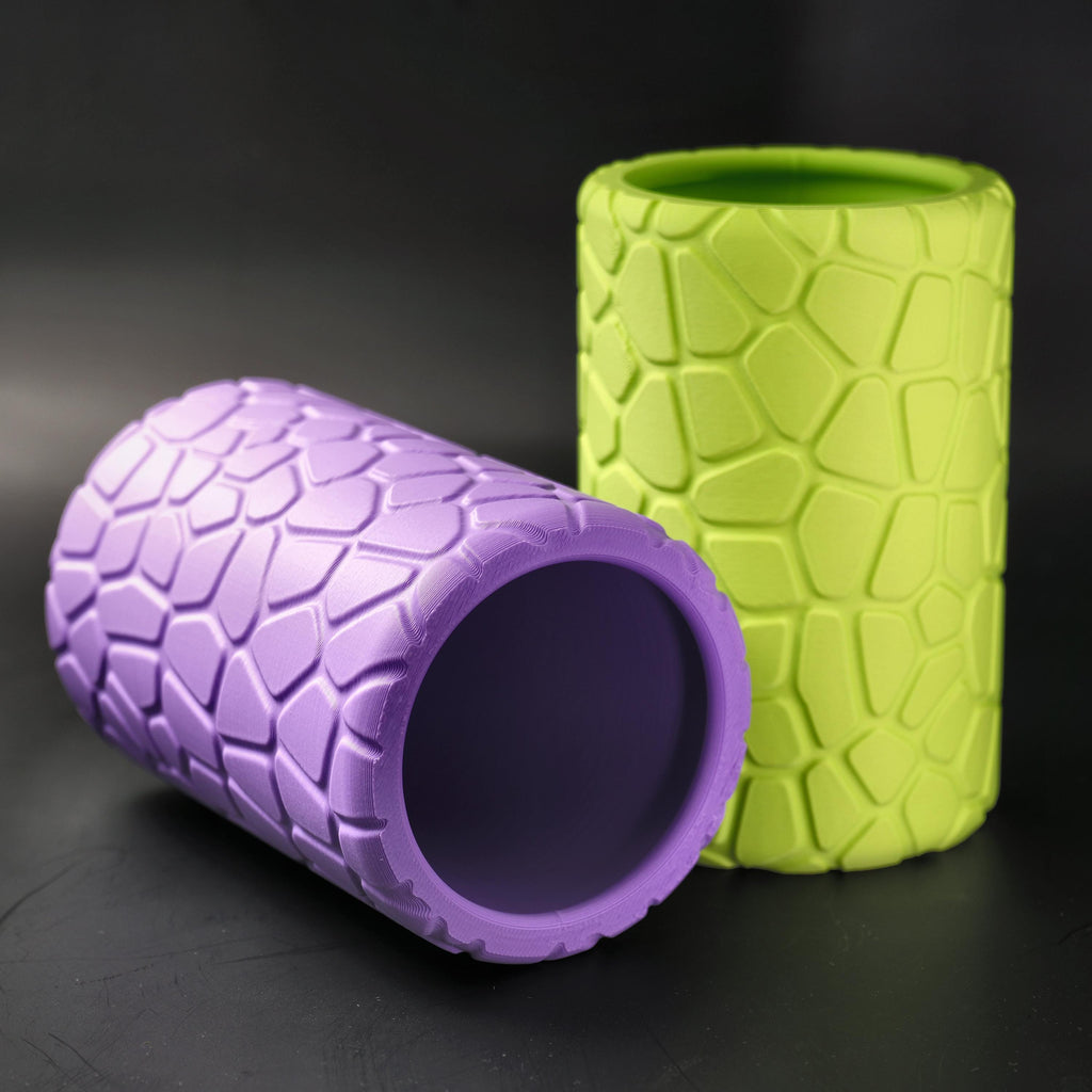 Purple pot lying on its side in front of the lime pot