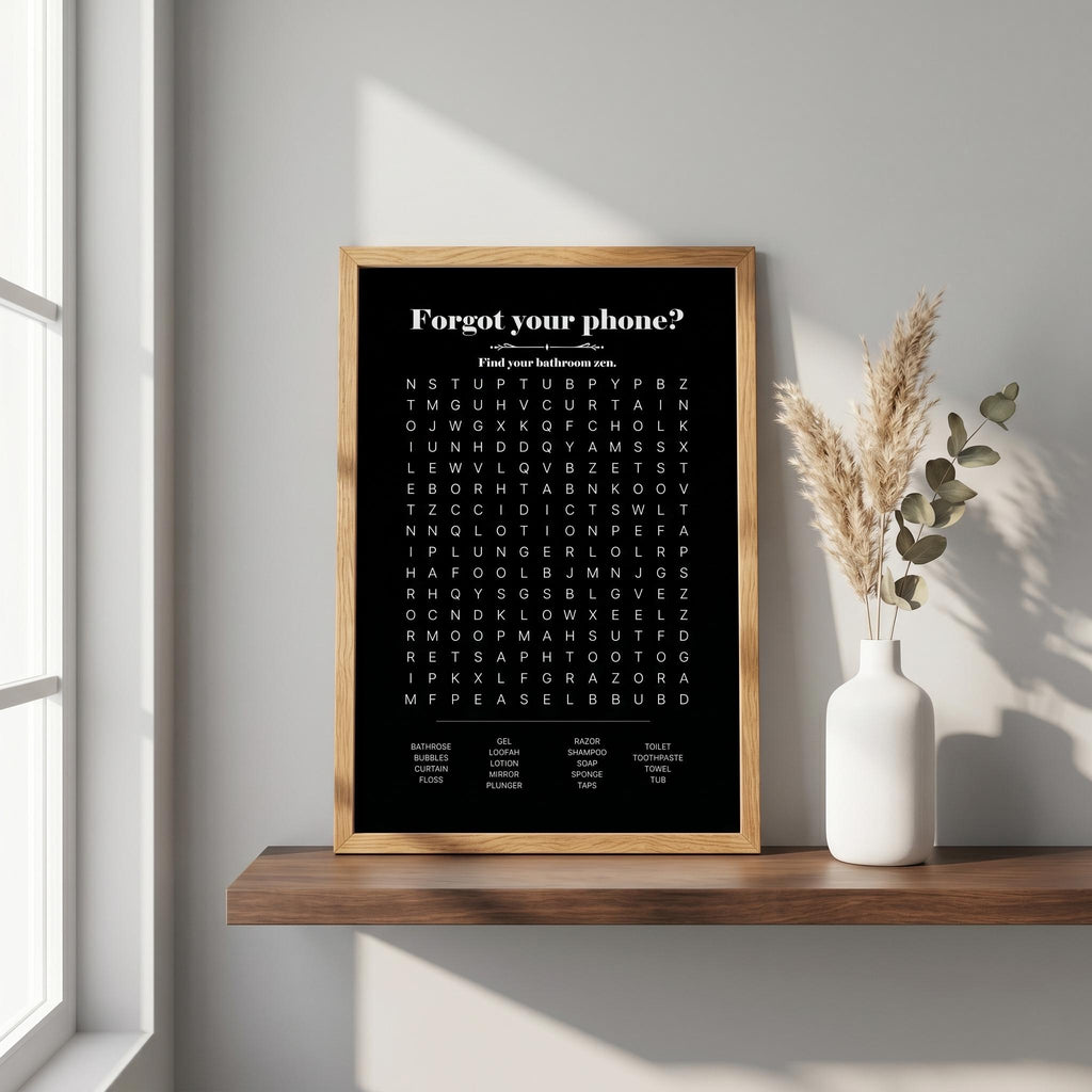Black bathroom word search print in a wood frame