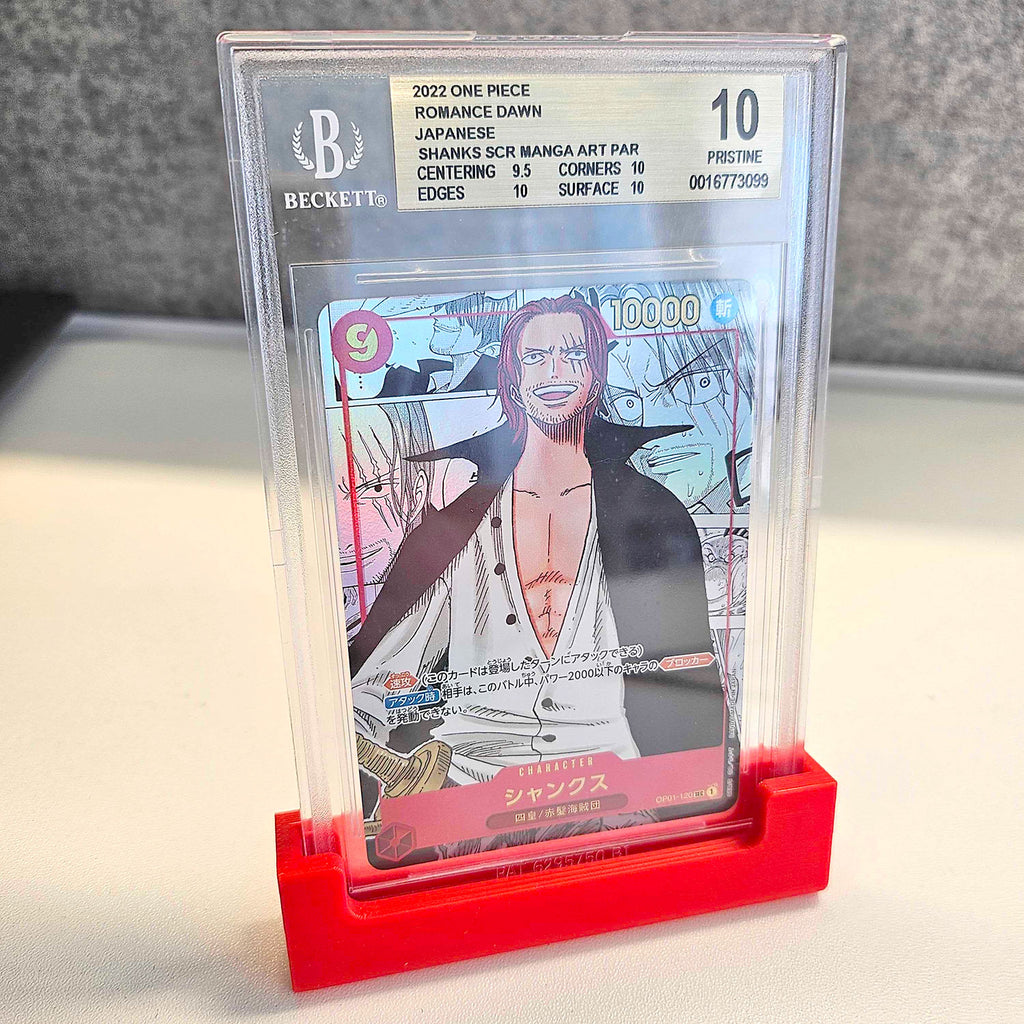 Collection of graded trading cards in PSA, BGS, and CGC slabs on a display stand