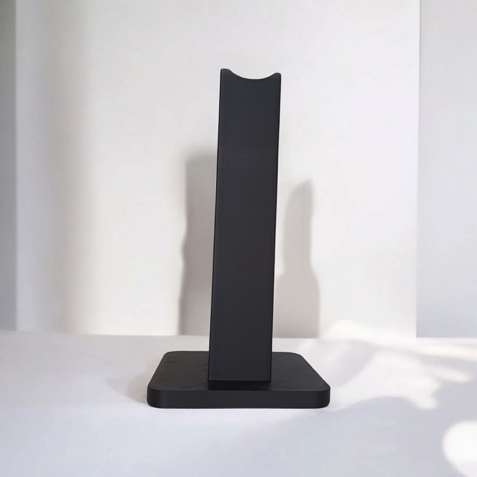 Close-up of the modern logo on a customisable headphone stand