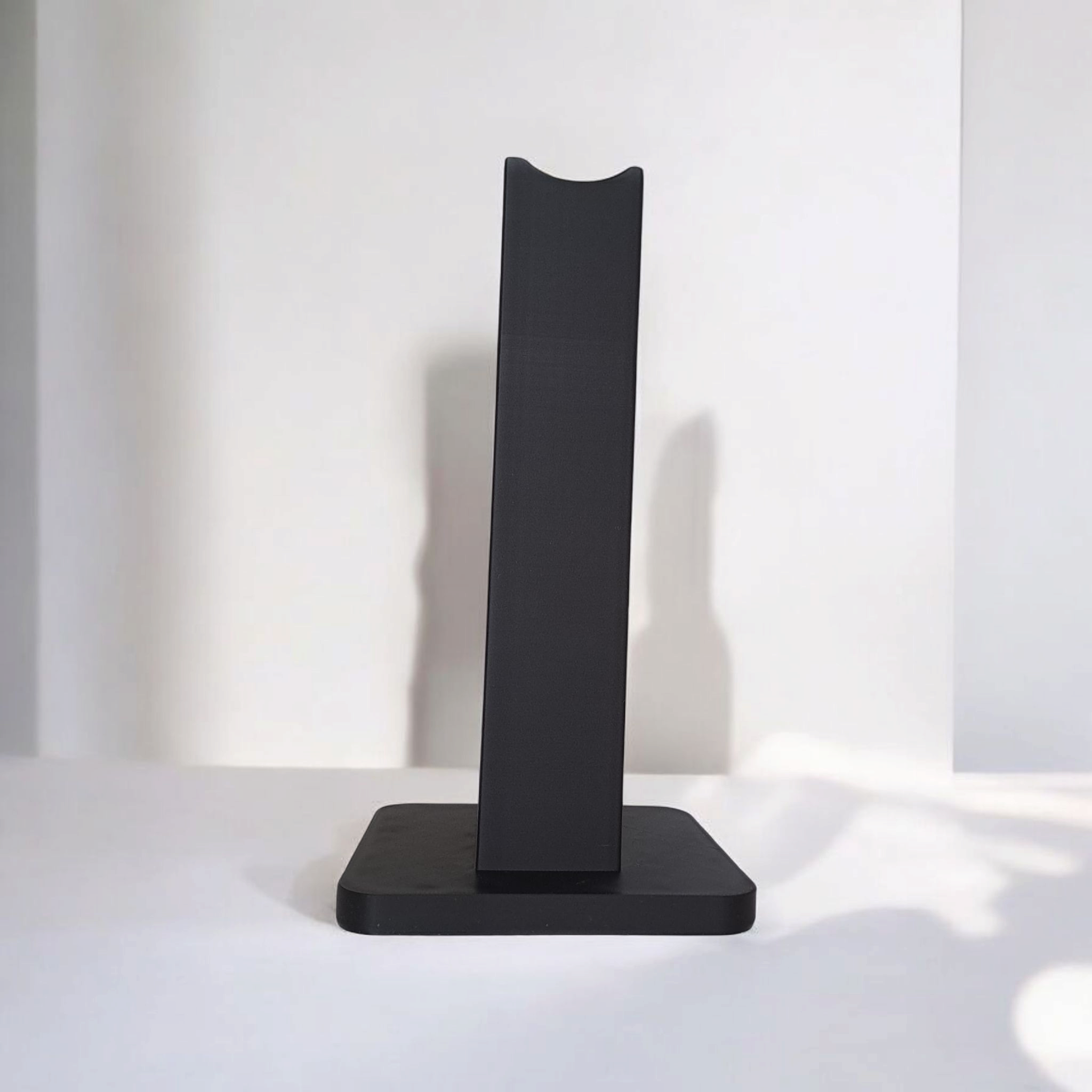 Close-up of the modern logo on a customisable headphone stand