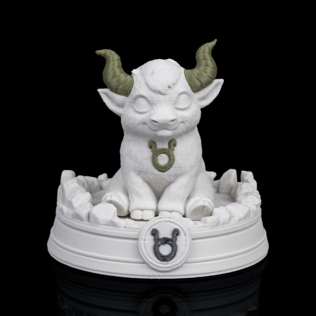 Taurus chibi bull on its base from the front, the Taurus symbol on the base