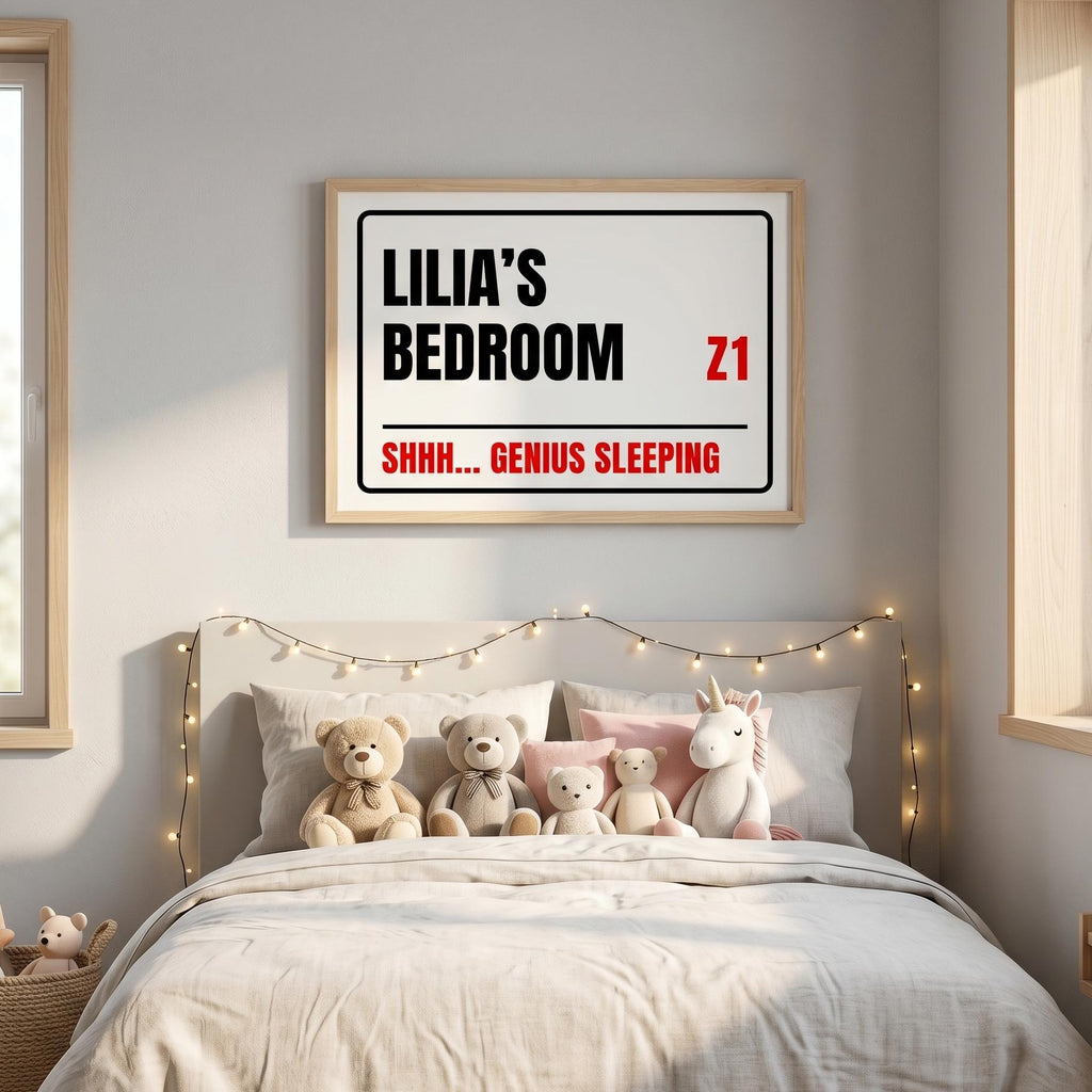 Street sign print reading Lilia's Bedroom, Z1, Shhh... Genius Sleeping, above a child's bed