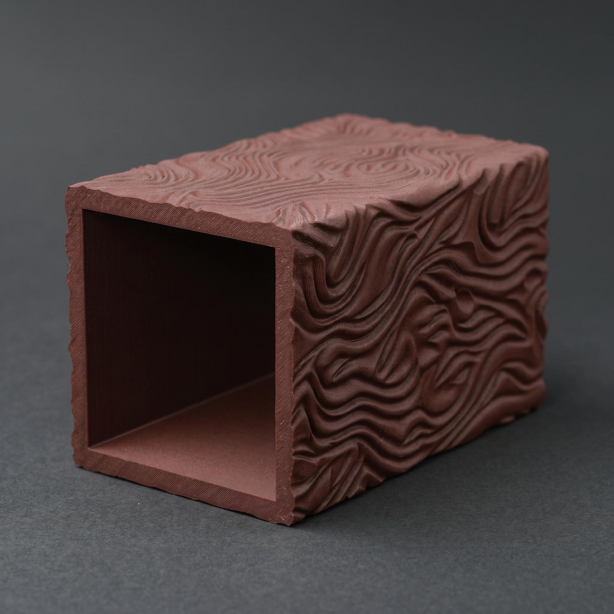 Terracotta pencil holder lying on its side