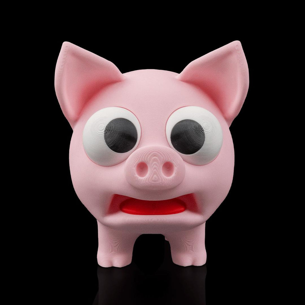 Pork Chop pig from the front, with big googly eyes and an open mouth