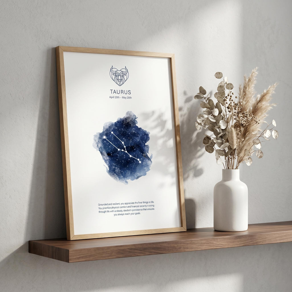 Taurus zodiac constellation print in indigo watercolour, with the Taurus symbol and dates, in a wood frame on a shelf