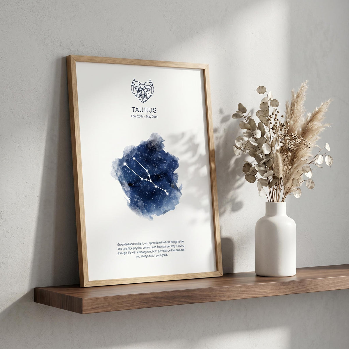 Taurus zodiac constellation print in indigo watercolour, with the Taurus symbol and dates, in a wood frame on a shelf
