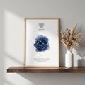 Gemini zodiac constellation print in indigo watercolour, with the Gemini symbol and dates, in a wood frame on a shelf