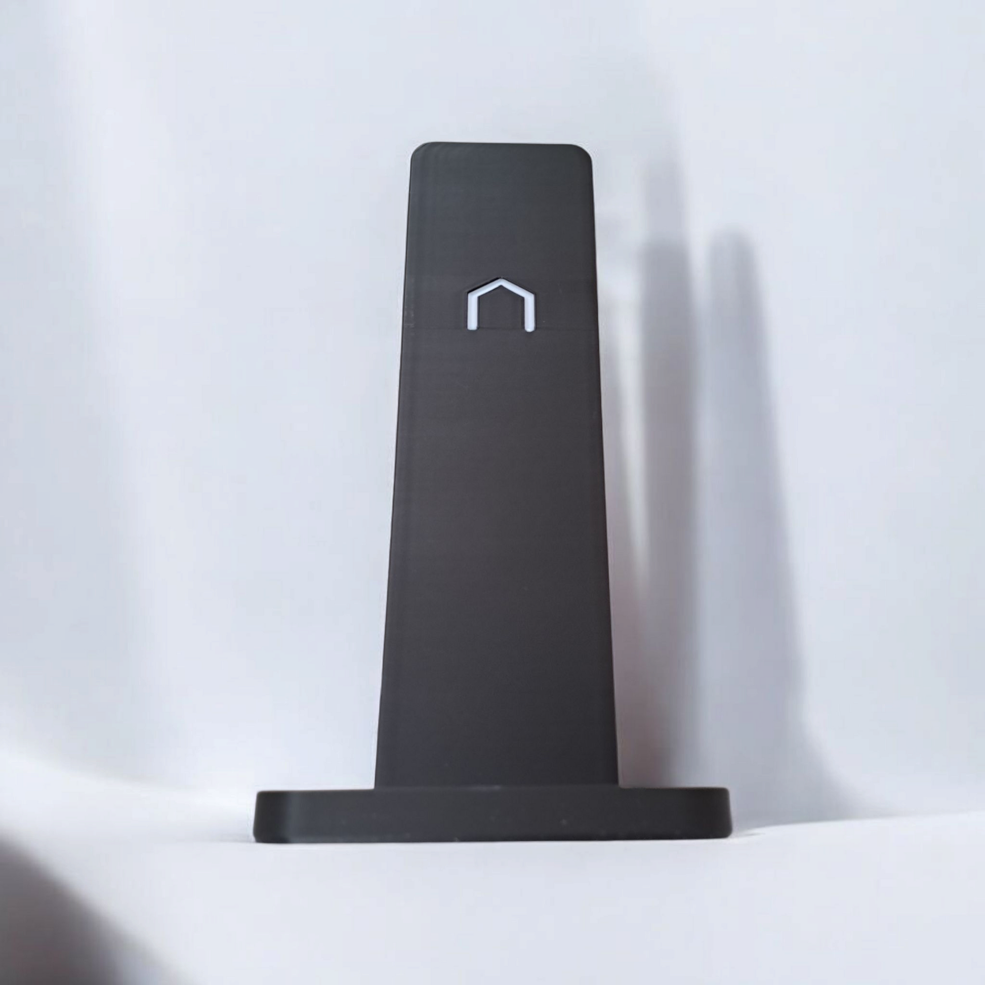 Sleek headphone stand in a modern office workspace