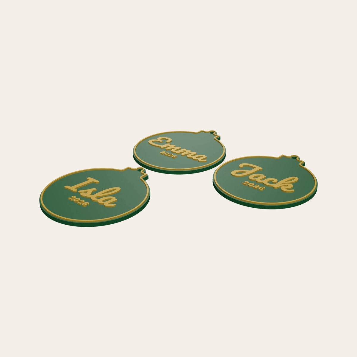 Three personalised bauble ornaments in green and gold, each with a name and the year