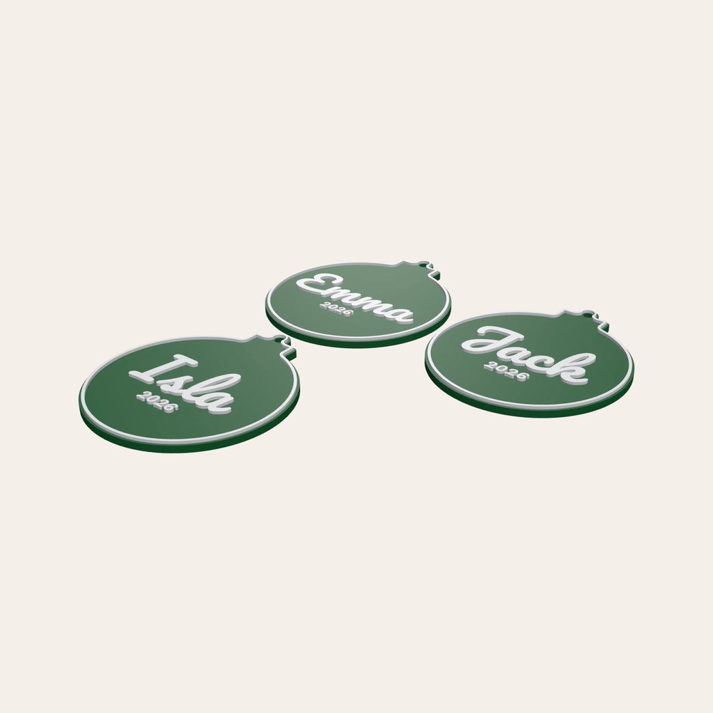 Three personalised bauble ornaments in green and white, each with a name and the year