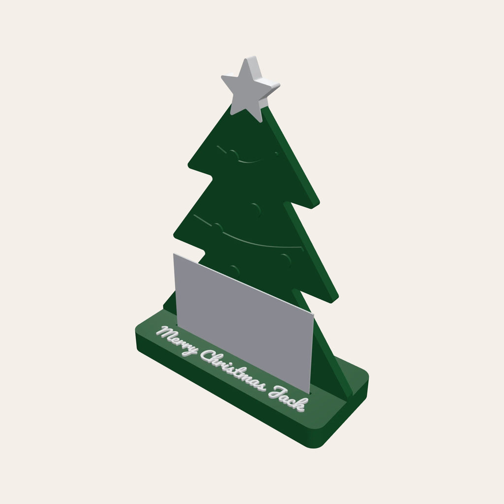 Christmas tree gift card holder in green and white, a card in the slot and a name on the base