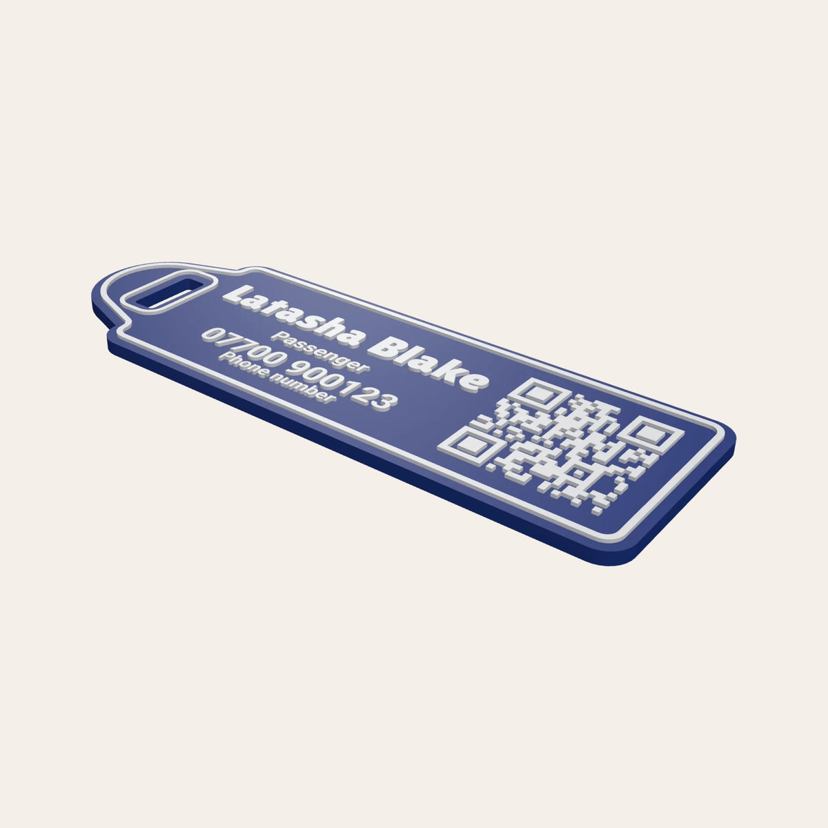 Navy personalised luggage tag with the name Latasha Blake, Passenger, a phone number and a white QR code