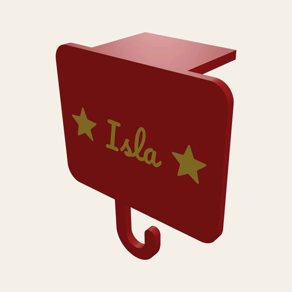 Personalised stocking holder in red and gold: a name plaque with stars, a mantel clip and a hook