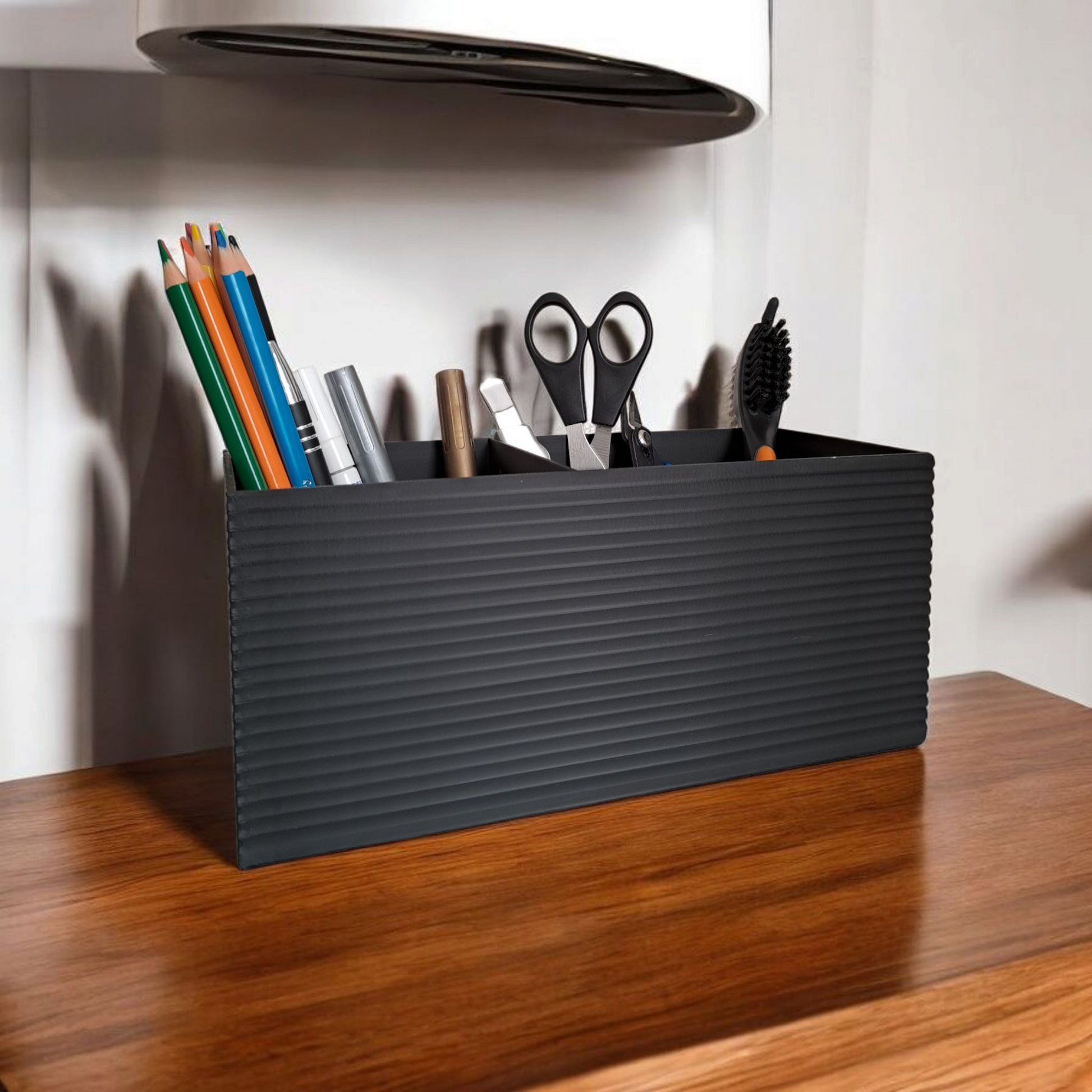 Ribbed office organiser holding pens and remote controls