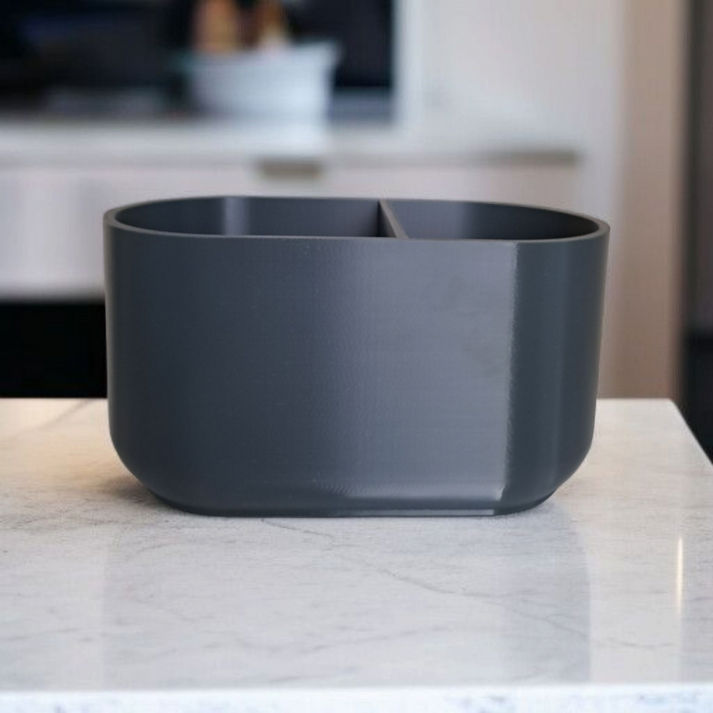Gray storage bin on a marble surface with a blurred background