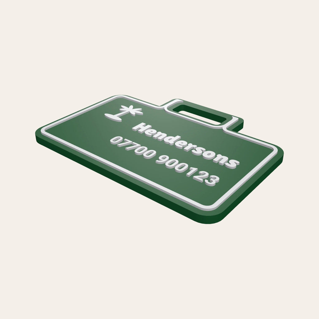 Green suitcase-shaped luggage tag with a palm tree icon and the name Hendersons
